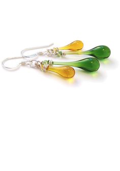 Get ready to wear these earrings everyday - that’s how much you’ll love them! More than minimal, less than dramatic, these are everyday earrings you’ll be comfortable wearing to any event. A charming pairing of complementary colored drops of sun-melted glass, these earrings are extraordinarily versatile. Let your outfit match or complement one color or the other. Or neither - those neutrals and monochrome clothes need something to pop! Earring length: 1 1/4" - 2 1/4" (3.2 cm - 5.7 cm) Eco-friend Chime Earrings, Monochrome Clothes, Drop Jewelry, Backyard Studio, Glass Drop Earrings, White Jewelry Box, Changing Leaves, Earrings Everyday, Eco Friendly Jewelry