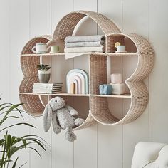 a shelf that has some items on it and a stuffed animal in front of it