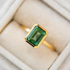 14k Emerald Ring, Green Emerald Bezel Ring, Emerald Cut Bezel Ring, Emerald Bezel Engagement Ring, Emerald Solitaire Ring, May Birthstone   Main Stone: Emerald ( Lab - Created ) Main Stone Color: Green Main Stone Shape: Emerald S I L V E R J E W E L R Y C A R E Silver is not the best friend of oxygen and sulfur; it can be oxidized and tarnished from time to time it is the nature of silver. To keep the silver shiny and prevent it from oxidizing fast, we would recommend the following instructions; * Avoid any chemical agents including perfume, makeup, and hair spray. * Avoid wearing silver jewelry to the beach, shower, or exercise. * Remove before you sleep, clean it with a silver cloth, and keep it in a dry area or a small zip-lock package. G E M S T O N E C A R E Major semi-precious gemsto Engagement Ring Cluster, Green Diamond Rings, Rajputi Dress, Smaragd Ring, 10 October, Green Topaz, Local Eclectic, Emerald Rings, Green Emerald Ring