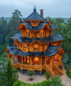 a large wooden house in the middle of some trees