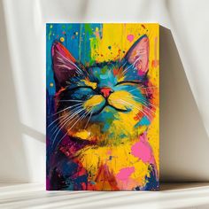 a colorful painting of a cat with its eyes closed