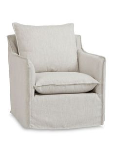 a white chair with a beige pillow on it's back and the seat upholstered