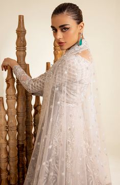 Elegant Silver Thorn Pakistani Wedding Dress Pishwas Frock Style is a breathtaking attire adorned with hand-crafted embellishments. Lavish designs and fine details of embroidery make this Pakistani Wedding Dress a breathtaking attire your foremost priority for the big day. Pishwas Frock: This Pishwas Frock is emblazoned with Lavish embroidery, motifs, sequins, and beads give a glamorous touch to the Pishwas Dress. Floral designs and shimmering silver details make this Pakistani Wedding Dress in Semi-stitched Dabka Work Wedding Gown, Semi-stitched Floor-length Dresses With Pearl Embroidery, Floor-length Dresses With Pearl Embroidery For Ceremonies, Eid Wedding Dress With Sheer Dupatta, Eid Ceremony Wedding Dress With Sheer Dupatta, Semi-stitched Anarkali Wedding Dress With Dabka Work, Anarkali Dress With Pearl Embroidery For Eid, Anarkali Wedding Dress With Dabka Work, Semi-stitched, Wedding Dress With Intricate Embroidery In Georgette