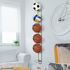 a living room filled with furniture and a wall mounted basketball on the side of it