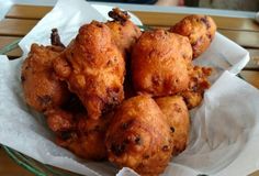 some fried food in a basket on a table