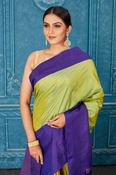 Look elegant on special occasions in this beautiful pista green Kanjivaram silk sari. The saree has a blue border and zari pallu. It comes with a matching blouse piece. Disclaimer: The shown stitched blouse on the model is for display purpose only. The saree comes with a matching blouse piece and finished with fall and piko. Party Sarees, Kanjivaram Sarees, Fashion Journals, Work Sarees, Traditional Fabric, Bollywood Saree, Handloom Saree, Indian Sarees, Blouse Piece