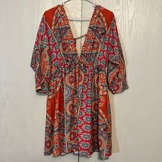 Nwt Boho Deep V Neck Dress Multi Color Paisley Print 3/4 Sleeves Elastic Empire Waist Tie Back Full Skirt 100% Polyester Unbranded Shoulder To Hem 34” Pit To Pit 21” Size L Stunning Colors! Beautiful! Bohemian V-neck Mini Dress With Vibrant Print, Flowy Orange Mini Dress For Beach, Orange Half Sleeve Summer Dress, Casual Orange Half Sleeve Dress, V-neck Mini Dress With Vibrant Print For Day Out, Flowy Orange Mini Dress For Vacation, Orange Floral Print Dress For Beach, Casual Orange Beach Cover-up Dress, Orange Bohemian Mini Dress For Vacation