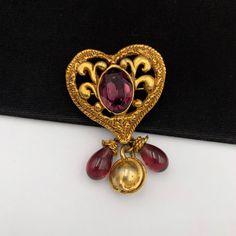 **** Please read and understand all ****100% Authentic Christian Lacroix Vintage Heart with Beaded Drop BroochHardware: Gold plated, Beaded, other Overall Condition: Good pre-owned condition. Includes: nothing Delivered with a jewellery box, not the original box.Measurements approximate: - L4 H7 cmCondition DescriptionsNew - Brand-new, not previously worn or owned. Undamaged and shows absolutely no signs of wear.Excellent - Previously owned, like new or lightly worn, with no signs of use and is Elegant Heart-shaped Wedding Brooch, Vintage Heart-shaped Brooch Jewelry, Vintage Heart Shaped Brooch Jewelry, Vintage Brooch For Valentine's Day Formal, Vintage Heart Shaped Brooch, Elegant Brooch For Valentine's Day, Gold Brooches For Valentine's Day Formal, Gold Brooches For Formal Valentine's Day, Gold Brooches For Valentine's Day