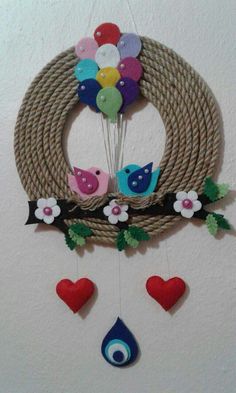 a wall hanging decoration with birds and balloons