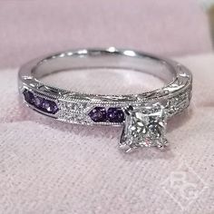 a diamond and purple sapphire engagement ring