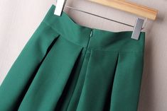 Vintage A Line Big Bow Side Zipper High Waist Pleated Knee Length Skirt                                                                           Material:  Cotton + Polyester                                                                              Size Description:   (1 cm = 0.3937 inch) Medium length, elastic waist  Type: high waist waist   S    Size: Waist  66cm   Length 58cm      M   Size: Waist   70cm   Length 58cm     L   Size: Waist   74cm   Length 58cm     XL Size: Waist 78cm  Length High Waist Green Denim Skirt, High Waist Stretch Pleated Skirt With Elastic Waistband, Spring Skirt With Zipper Closure And Stretch, Spring Stretch Skirt With Zipper Closure, High Waist Skirt With Side Zipper For Spring, High Waist Skirt With Zipper Closure For Summer, High Waist Green Skirt For Work, High Waist Green Bottoms With Zipper Closure, Pocket Jacket