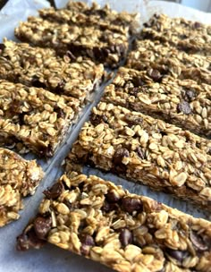 granola bars cut into squares and stacked on top of each other, ready to be eaten