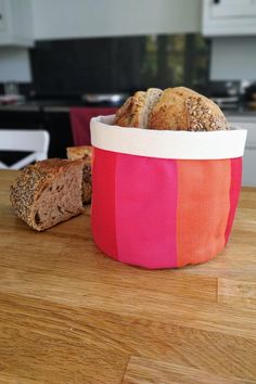 bread in a bag sitting on top of a wooden table