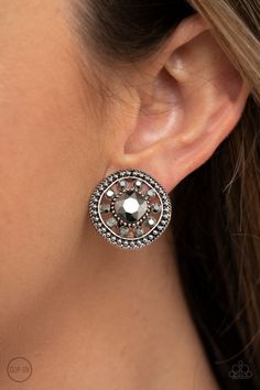 Featuring an oversized center, a hematite rhinestone encrusted flower blooms across the silver center of a studded frame for a sparkly finish. Earring attaches to a standard clip-on fitting.

Sold as one pair of clip-on earrings. Live Text, Trendy Fringe, Colorful Frames, Feather Fan, Pink Acrylics, Paparazzi Accessories, White Rhinestone, Paparazzi Jewelry, Hammered Silver