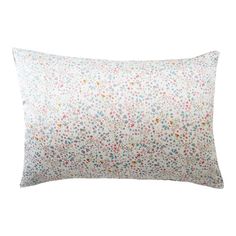 a white pillow with colorful flowers on it