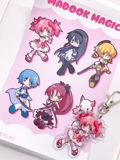 the keychain is decorated with many different anime characters on it's side