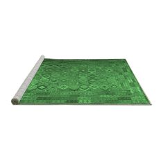 a green rug with an intricate design on the top and bottom, in front of a white background