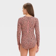 Add an eye-catching look to their swimwear with this Leopard Spots One-Piece Rash Guard from art class™. This long-sleeve rash guard swimsuit features a black leopard spots pattern detailed with top stitching on a contrasting-color background and has a cutout middle for a stylish look. Made from 4-way stretch opaque fabric, it offers flexible comfort and modest coverage both in and out of the water. The back half-length zipper allows for easy dressing and removal, and the UPF 50+ rated material Rashguard Swimsuit, Spots Pattern, Leopard Spots, Fabric Tape, Top Stitching, Rash Guard, Pair Of Pants, Body Measurements, Simple Dresses