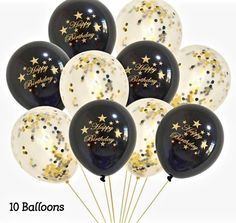 black and white balloons with gold stars on them