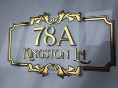 the sign for 78a kingston in is gold and black