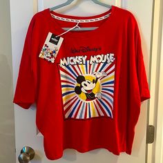 Nwt Disney Classic Mickey Mouse Colorburst Graphic T-Shirt Condition: All Are Brand New, Never Worn, With Original Tags. Description: Grab This Classic Disney Merch For A Much Better Price Than Retail And Rock This Adorable, Comfy, And Colorful, Old-School Mickey Tee With Pride. Features: Authentic, Licensed Disney Large Mickey Mouse Graphic Machine Washable Soft Cotton Polyblend Colors: Red With White/Blue/Red/Yellow Colorburst & Mickey Mouse Graphic In Center. Sizing: U.S. Women’s Large & Extr Red Disney Crew Neck Top, Pop Culture Mickey Mouse Tops For Disney Fan Events, Cotton Graphic Tee For Disney Fan Events, Red Short Sleeve Top With Mickey Mouse, Multicolor Graphic Print Top For Disney Fan Events, Red Mickey Mouse T-shirt For Disney Fan Events, Red Disney Graphic Print Top, Disney Graphic Print Tops For Fan Merchandise, Fun Mickey Mouse Tops For Disney Fan Events