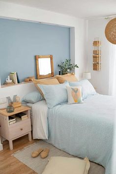 a bed room with a neatly made bed next to a window and a wooden dresser