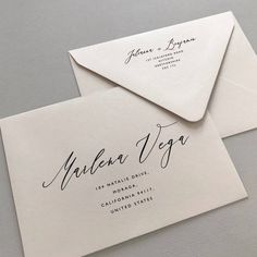 two envelopes with calligraphy on them