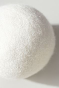 a white ball sitting on top of a table