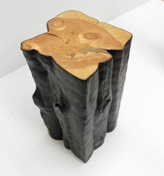 a piece of wood that has been cut in half and is sitting on a table