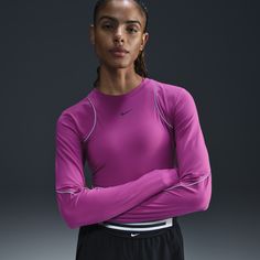 Day or night, rain or shine, this slim-fitting Running Division top offers the features you need to navigate the paved landscape. Lightweight and stretchy, the smooth fabric dries quickly to help you stay comfortable mile after mile. Reflective piping gives the classic look a little glow-up. Purple Day, Night Rain, Nike Long Sleeve, Running Tank Tops, Shirt Nike, Rain Or Shine, Running Jacket, Running Tops, Nike Running