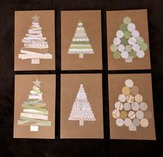 four pieces of brown paper with white and green christmas tree cut outs on them, sitting next to each other