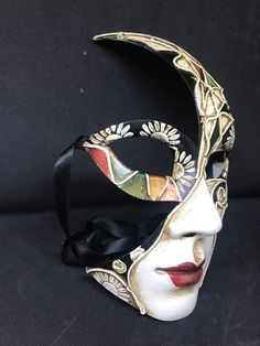 Venetian Mask Masquerade for Men or for Women - Traditional and original papier-mache Venetian mask, handmade and decorated with acrylics colors , stucco (stuggles ) and glitter All our masks are handmade papier-machè masks made in Venice. Our decorators use techniques typical of the Venetian tradition such as stucco, acrylics, gold and silver-leaf, macramè, passementerie, glitters and crequelè to offer you a wide range of original handmade masks and decorations This shape is available in differ Artistic Hand Painted Masks For Carnival, Artistic Multicolor Masquerade Mask For Carnival, Artistic Hand Painted Masks And Prosthetics For Carnival, Artistic Masks And Prosthetics For Mardi Gras, Artistic Multicolor Masquerade Masks, Artistic Multicolor Masks For Carnival, Artistic Multicolor Masks For Masquerade, Artistic Masks For Carnival And Art Events, Hand Painted Black Mask For Masquerade