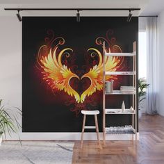 an artistic heart with wings on a black background wall mural