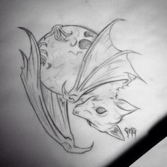 a drawing of two bats on the side of a wall