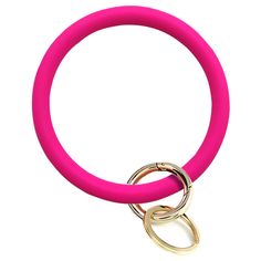 a close up of a pink ring on a white background with an open gold loop