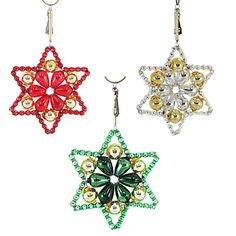 three christmas ornaments hanging from hooks on a white background, each decorated with different colored beads