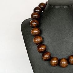 Wood Bead Necklace, Chunky Wood Necklace, Wooden Necklace, Brown Beaded Necklace, Unisex Necklace, Mens Wood Necklace, Mens Boho Necklace This unisex necklace was hand beaded using large 25mm round brown wooden beads. It measures approximately 20 inches long and is securely fastened with a silver clasp. The end result is a classic piece that fits in perfectly with today's fashion trends! Want a different length? Just ask! Check out the matching earrings: https://www.etsy.com/listing/541287677/wo Wooden Beads Necklaces For Jewelry Making, Round Wooden Beads Necklaces For Jewelry Making, Brown Round Beaded Necklace With Large Beads, Brown Beaded Necklace With Large Round Beads, Brown Single Strand Necklace With Round Beads, Brown Polished Bead Round Necklaces, Brown Round Bead Necklaces For Jewelry Making, Brown Polished Beads Round Necklace, Brown Necklaces With Polished Beads