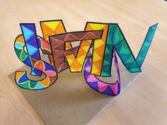 the letters are made out of colored paper