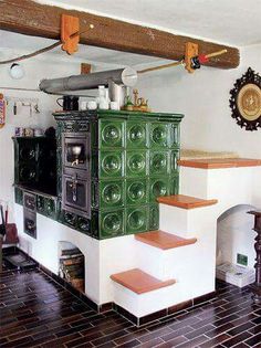 a kitchen with an oven and stairs in it