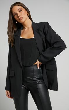 Elevate your outerwear game with our Michelle Blazer - Oversized Plunge Neck Button Up Blazer in Black! This edgy and fashion-forward blazer is perfect for any occasion, whether it's a casual day out or a night on the town. Made from high-quality polyester, this longline blazer features a plunging neckline and button-up closure for added style. With its oversized fit and long sleeves, it effortlessly combines comfort and sophistication. Pair it with jeans and sneakers for a cool daytime look or Oversized Outerwear For Night Out, Trendy Blazer With Button Closure For Night Out, Casual Party Outfit Night, Colourful Heels, Jeans Blazer Outfit, Workwear Wardrobe, Party Outfits Night, Casual Party Outfit