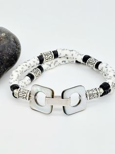 "Blanca bracelet- recycled vinyl discs in black and white with grey flecks  Cast pewter accent beads. Blacklip shell focal pieces with large box link. Stretch bracelet measures 7.5 inches and fits most wrists. Inspired by \"mother Blanca\" and the house of Evangelista 🏳️🌈 See other listing for matching earrings.  Handmade in 🇺🇲" Peruvian Blue Opal, Wedding Jewelry Bracelets, Green Quartz, Shell Jewelry, Quartz Earrings, Wedding Bracelet, Blue Opal, Stretch Bracelet, Stretch Bracelets