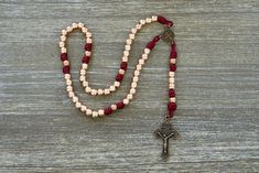 Crafted from high-quality materials, our "Strength and Virtue" rosary is built to last and withstand the challenges of daily life. This truly unique rosary boasts exquisite 10mm metal alloy Hail Mary beads in a stunning rose gold finish, elegantly complemented by antique copper Our Father beads. These durable and unbreakable components are paired with matching maroon paracord 275 for added strength and durability. This combination creates an aesthetically pleasing rosary that exudes both beauty Adjustable Rose Gold Spiritual Rosary, Adjustable Rose Gold Rosary As Gift, Paracord Rosary, Benedict Medal, Our Father, Hail Mary, Catholic Gifts, Spiritual Journey, Aesthetically Pleasing