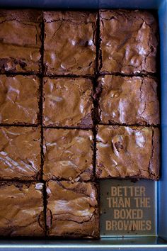 brownies in a blue box with a sign that says better than the boxed brownies