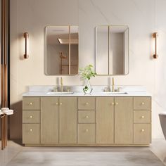 a bathroom with two sinks and mirrors on the wall