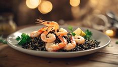 a white plate topped with rice and shrimp on top of a wooden table next to lights