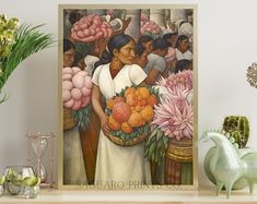 there is a painting on the shelf with flowers