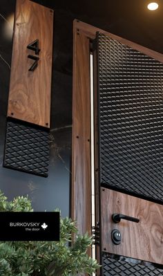 two wooden doors with metal grates on them