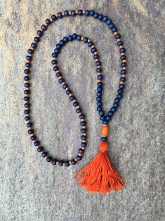 Long Beaded tassel necklace navy blue & orange wood necklace | Etsy Orange Tassel Jewelry With Round Beads, Spiritual Orange Jewelry With Wooden Beads, Orange Games, Orange Wood, Beaded Tassel Necklace, Wooden Barrel, Nape Of Neck, Long Beaded Necklace, Wood Necklace