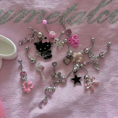 a pink blanket with some charms on it