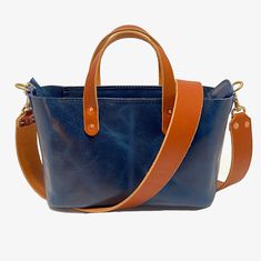 The Bella Crossbody Bag in Blue: Elegant, Durable, and Handcrafted Introducing The Bella Crossbody Bag—a stunning piece of craftsmanship, expertly made from one of the strongest leathers in the world: glazed full-grain water buffalo leather. Known for its incredible strength and unique pull-up effect, this leather develops a dazzling patina over time, making your bag truly one of a kind. Not only is buffalo leather extremely durable, but it is also highly resistant to weather and tearing, ensuri Blue Leather Rectangular Satchel, Blue Rectangular Satchel With Leather Lining, Blue Leather Shoulder Bag With Leather Lining, Blue Satchel With Leather Lining For Daily Use, Blue Leather Rectangular Bag, Blue Rectangular Leather Bag, Blue Leather Tote Shoulder Bag, Blue Bags With Leather Lining For Everyday Use, Blue Leather Shoulder Bag With Leather Handles